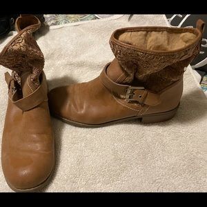 Guess booties. Small hole shown in photo